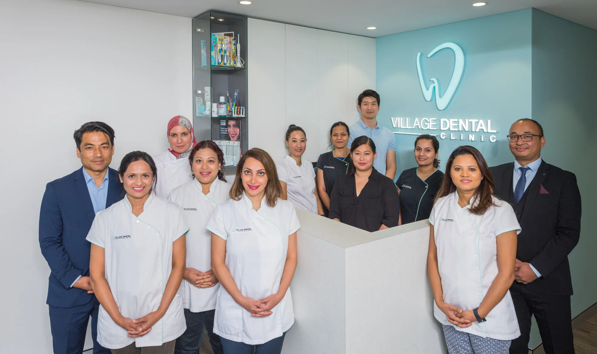 The Village Dental Clinic team at the reception desk of the Haymarket practice